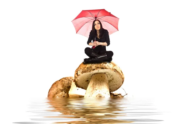 Sel Mantar Üzerinde Oturan Kadın Fotoğrafı — Stok fotoğraf