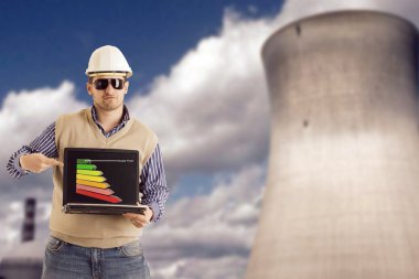 Engineer is presenting the vantages of nuclear energy with a graph on his notebook clipart