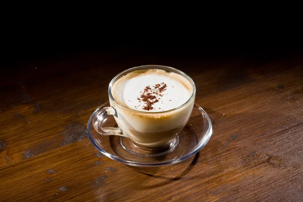 Cappuccino on wood table — Stock Photo, Image