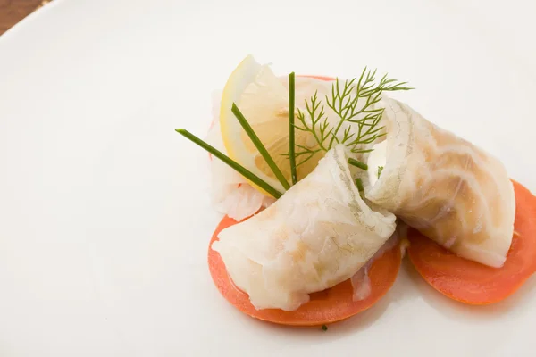 Sea Bass rolls with tomatoes — Stock Photo, Image