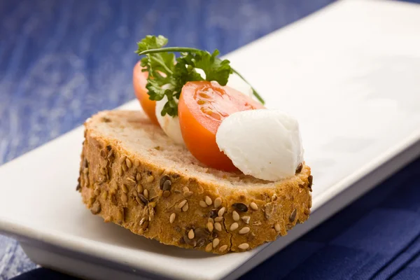 Sandwich with tomatoe and mozzarella — Stock Photo, Image