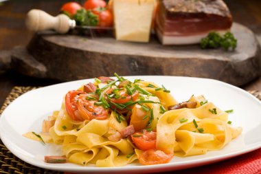 Pasta with bacon and tomatoes clipart