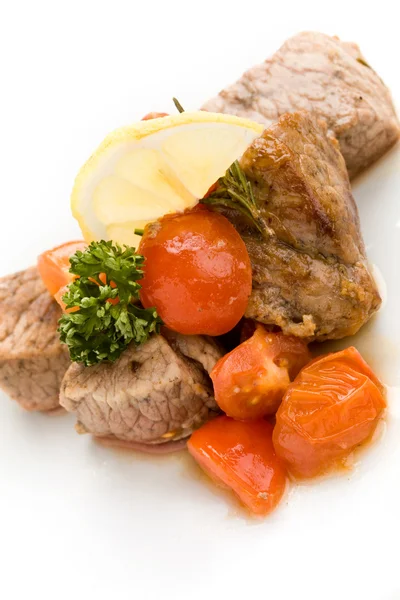 Meat with fresh tomatoes — Stock Photo, Image