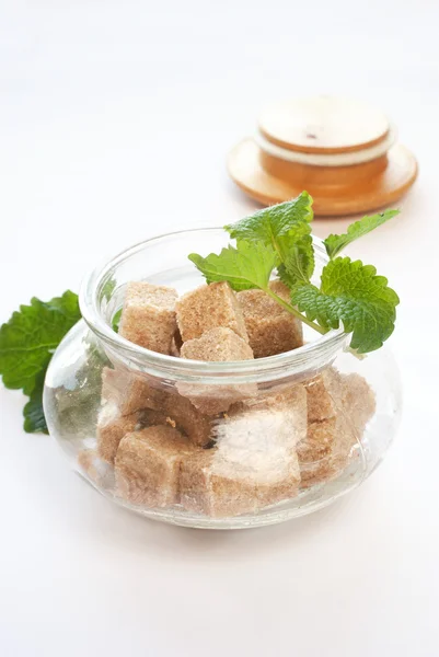 Brown sugar in glass bowl Stock Image