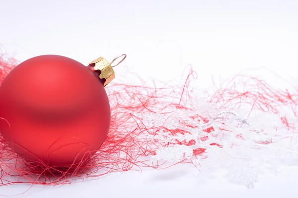 Red Christmas bauble and snowflake — Stock Photo, Image