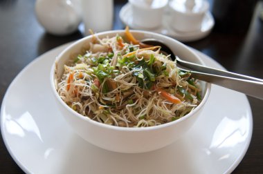 Asian fried rice noodle on a bowl clipart