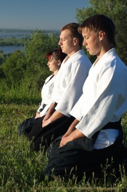 Three young aikido man clipart