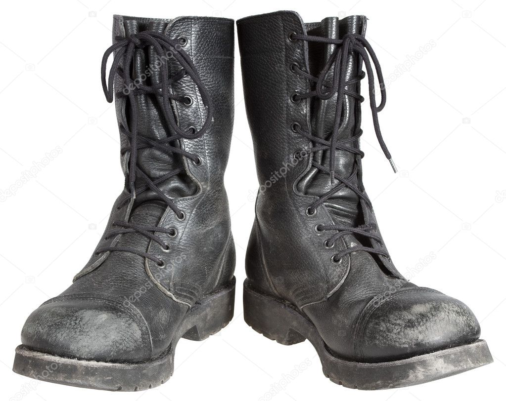 Used military boots isolated on white background