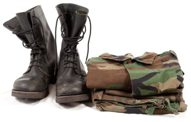 Military camouflage uniforms and boots. clipart