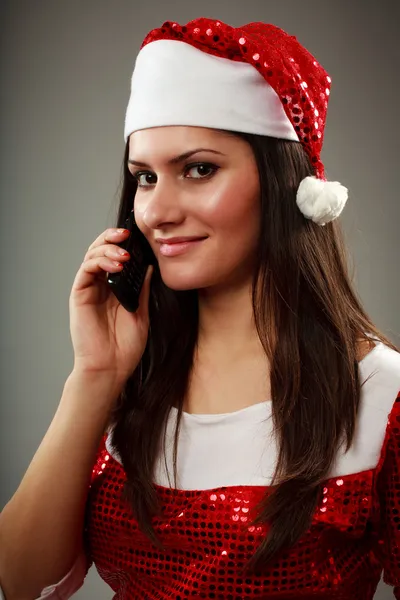 Menina de Natal falando com o Papai Noel no celular — Fotografia de Stock
