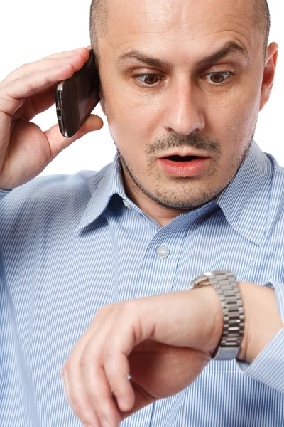 Uomo d'affari in ritardo guardando orologio — Foto Stock