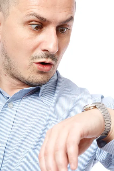 Late businessman looking at watch — Stock Photo, Image
