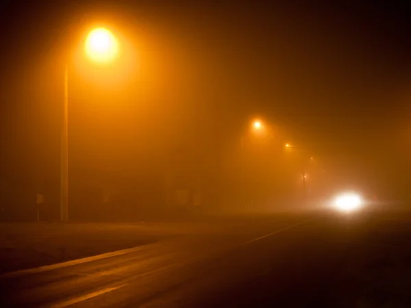 stock image Road in a very foggy night