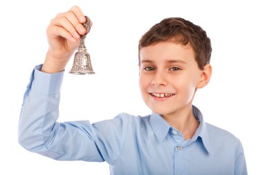 Portrait of a caucasian schoolboy ringing the bell for a course break clipart