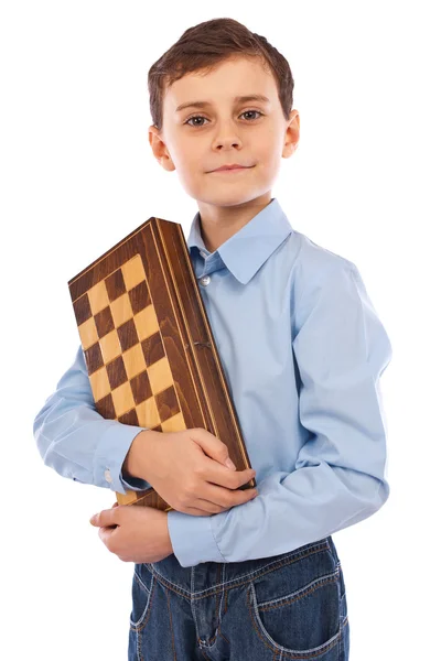 チェスのゲームを両腕に抱えてかわいい子供 — ストック写真
