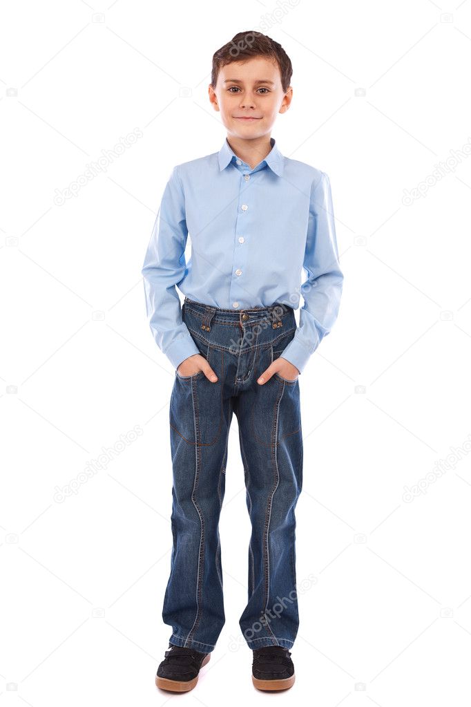 Cute school boy with his hands in his pockets, isolated on white background