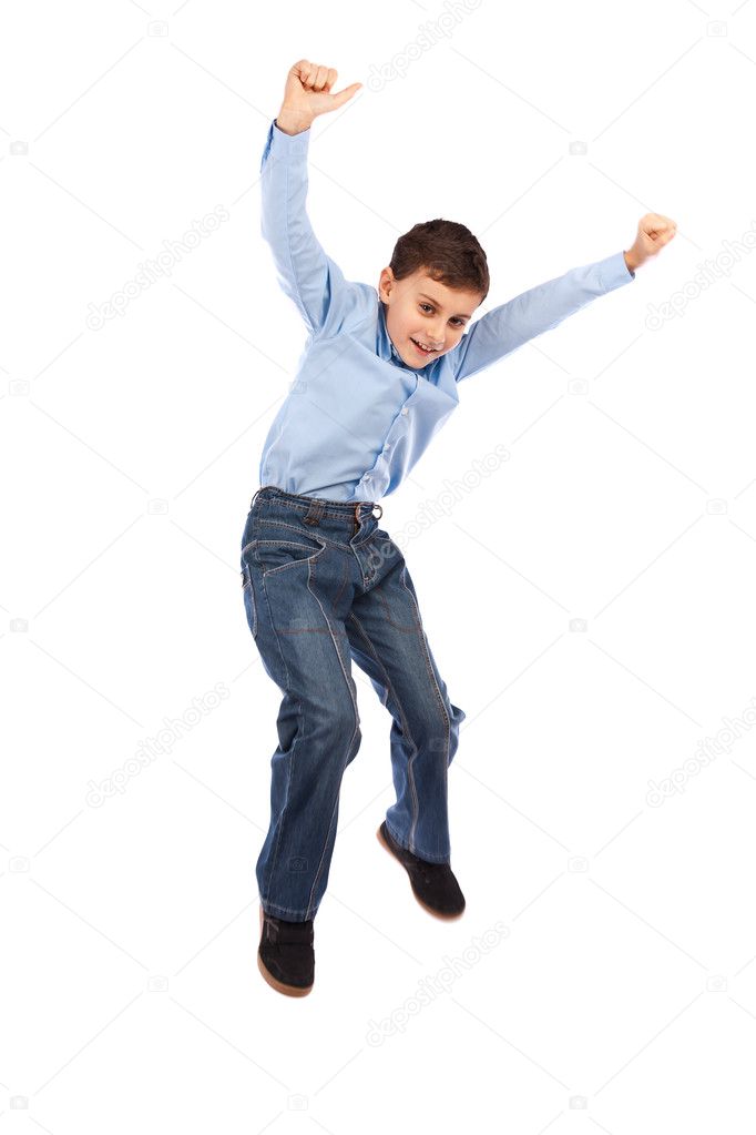 Happy kid jumping for joy, isolated on white background