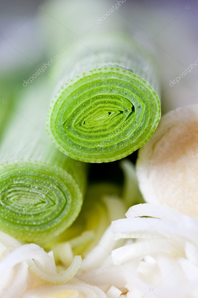 Closeup of a chopped leek on a wooden board in a kitchen