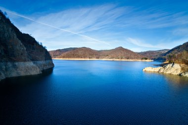 Landscape with dam lake Vidraru, in Romania clipart