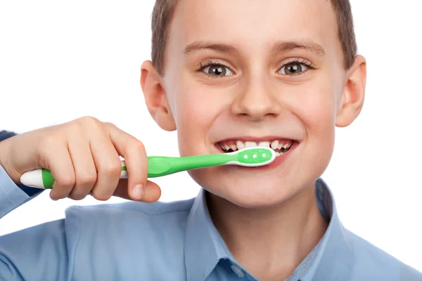 Child brushing his teeth Stock Photo