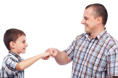 Father and son with a kind of high-five salute clipart