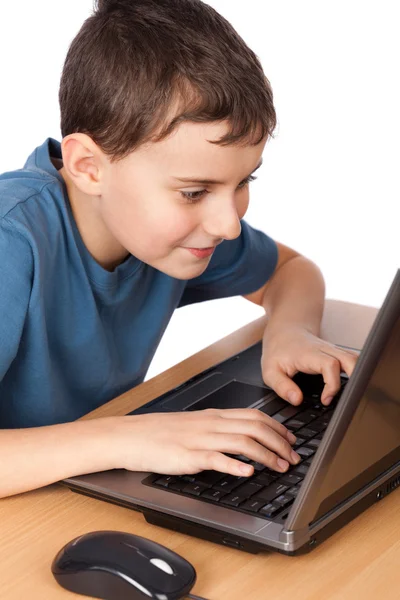 Skolpojke på den bärbara datorn Stockbild