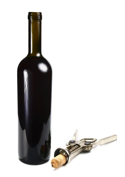 Garrafa com vinho tinto e saca-rolhas — Fotografia de Stock