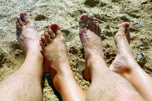 stock image Legs on sand of marine beach