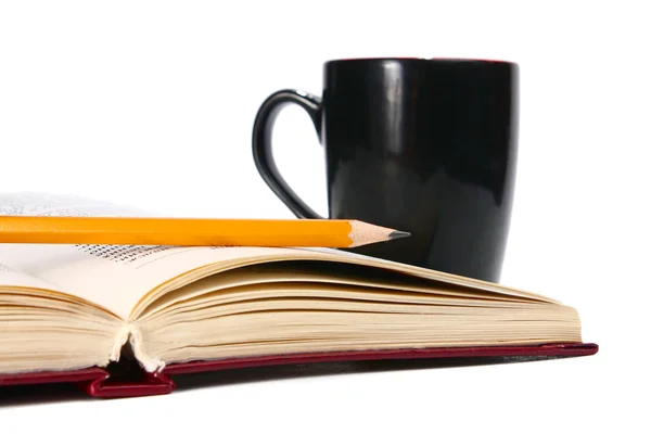 Boken är en cup och penna — Stockfoto