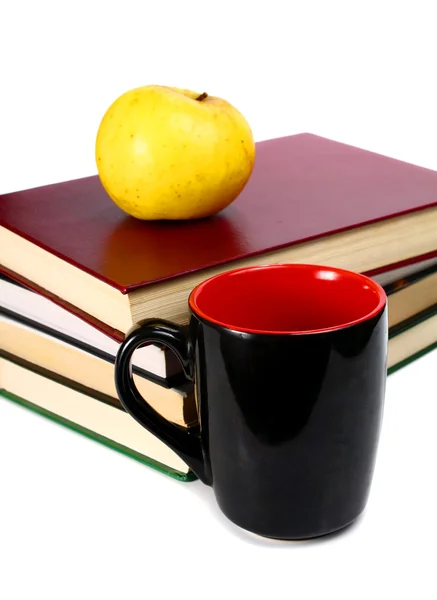 Los libros son una manzana y una taza — Foto de Stock