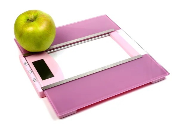 Podlahové váhy a zelené jablko — Stock fotografie