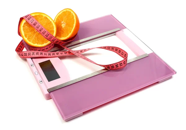 Floor scales measuring ribbon and orange — Stock Photo, Image