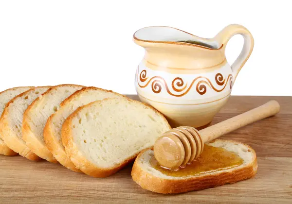 Miód w dzban i chleb na pokładzie — Zdjęcie stockowe