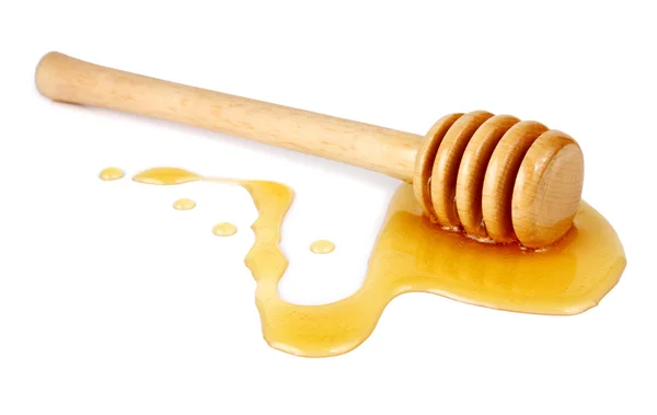 Miele che scende da un bastone di legno — Foto Stock