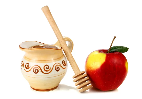 Miel en una jarra y manzana — Foto de Stock