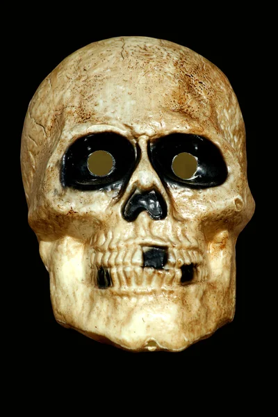 Страшный череп на черном — стоковое фото