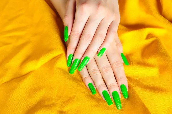 Bright green manicure on real nails — Stock Photo, Image