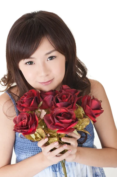 Happy young girl holding roses — Stock Photo, Image