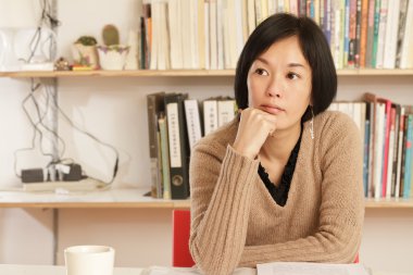 Woman sitting and thinking clipart