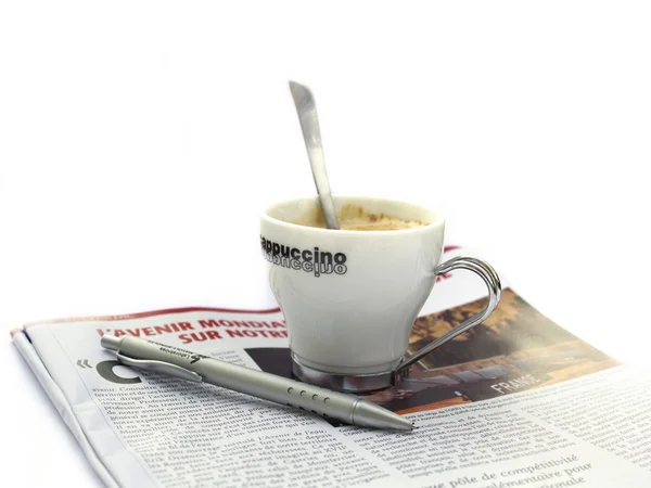 Coffee cap with french newspaper — Stock Photo, Image