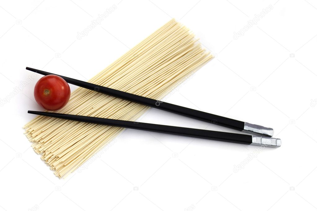 Japan noodles with chopsticks and cherry tomato isolated on whit