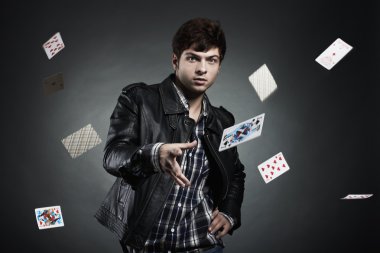 Portrait of the young man playing cards clipart