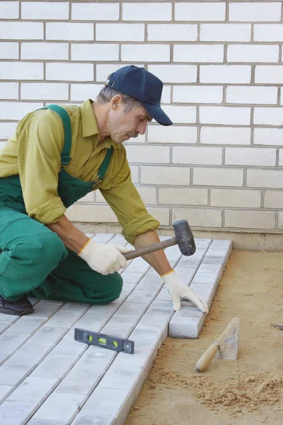 Laying pavement — Stock Image Laying pavement Royalty Free Stock Photos