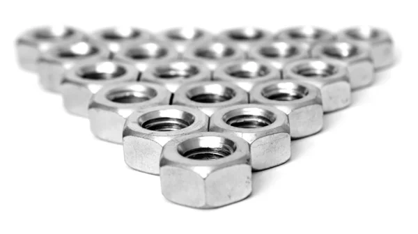 Layer of metal nuts — Stock Photo, Image