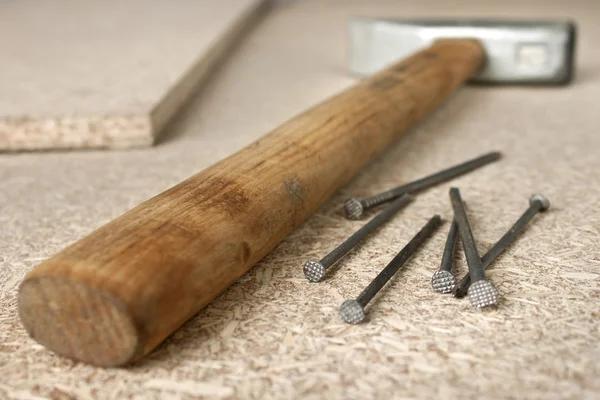 Hammer and a handful of nails — Stock Photo, Image