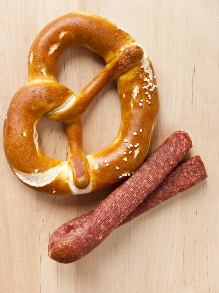 Pretzel and sausage Royalty Free Stock Images