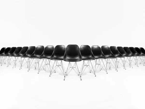 Vorming van zwarte stoelen — Stockfoto