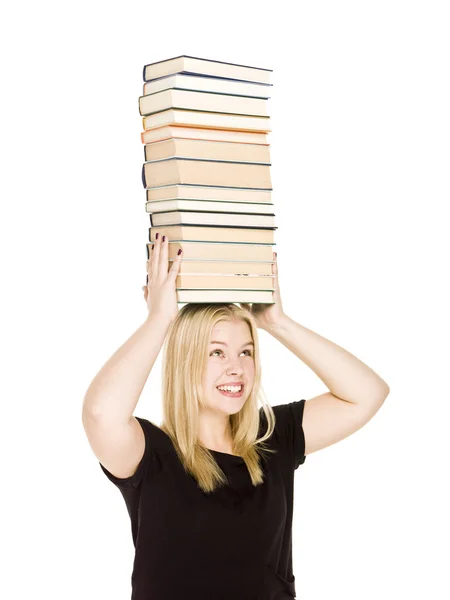 Kvinna med en hög med böcker på hennes huvud — Stockfoto