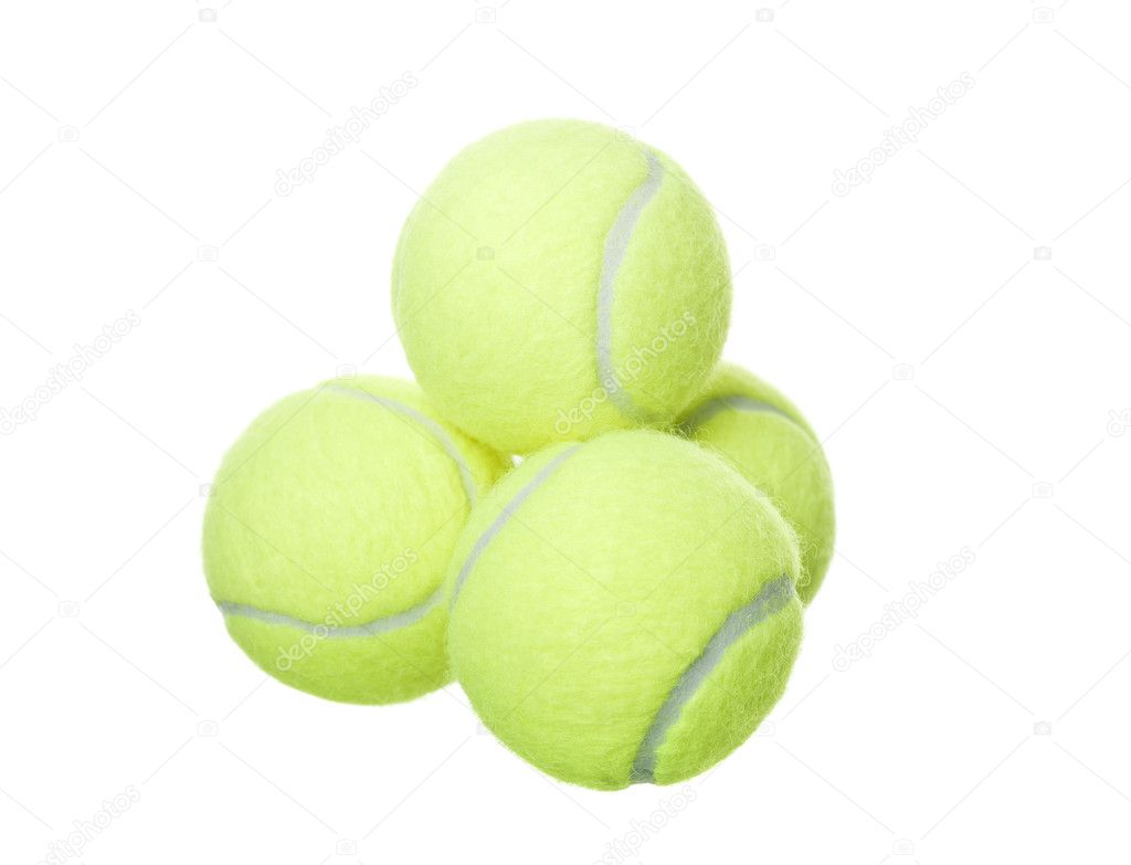 Pyramid of tennis balls isolated on white background