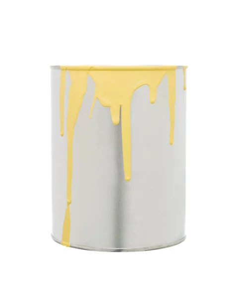 Lata de pintura con derrame amarillo — Foto de Stock